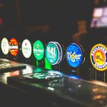 george-bakos-83HwuZirc-c-unsplash A photo of some pumps for drinks inside a pub.